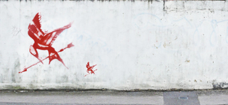 Illustration for article titled Catching Fire concept art of the Rue mural and Audubon-style Jabberjays